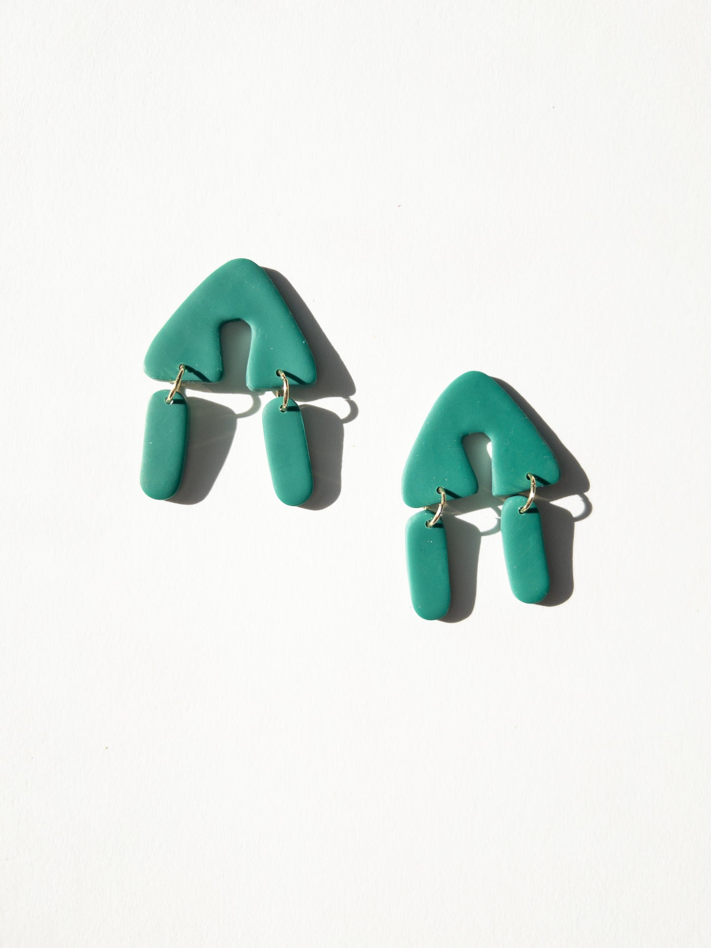 the party in the triangle green earrings