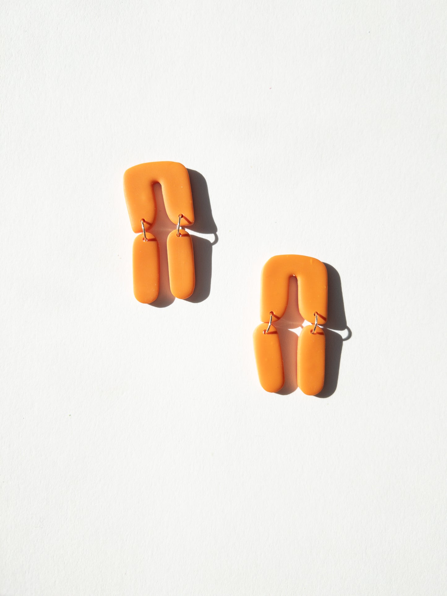 the orange popsicle arch dangle earrings