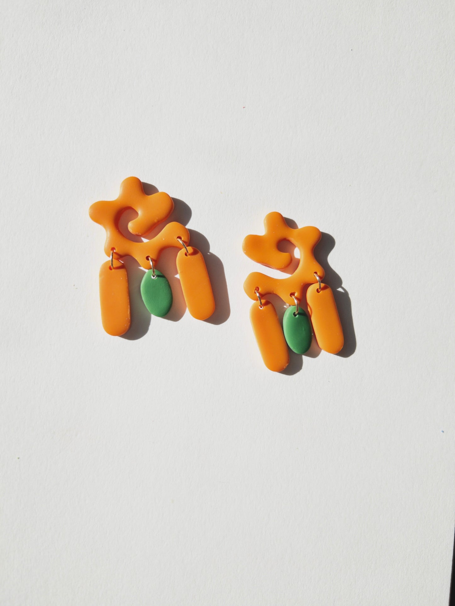 the clementine swirl earrings