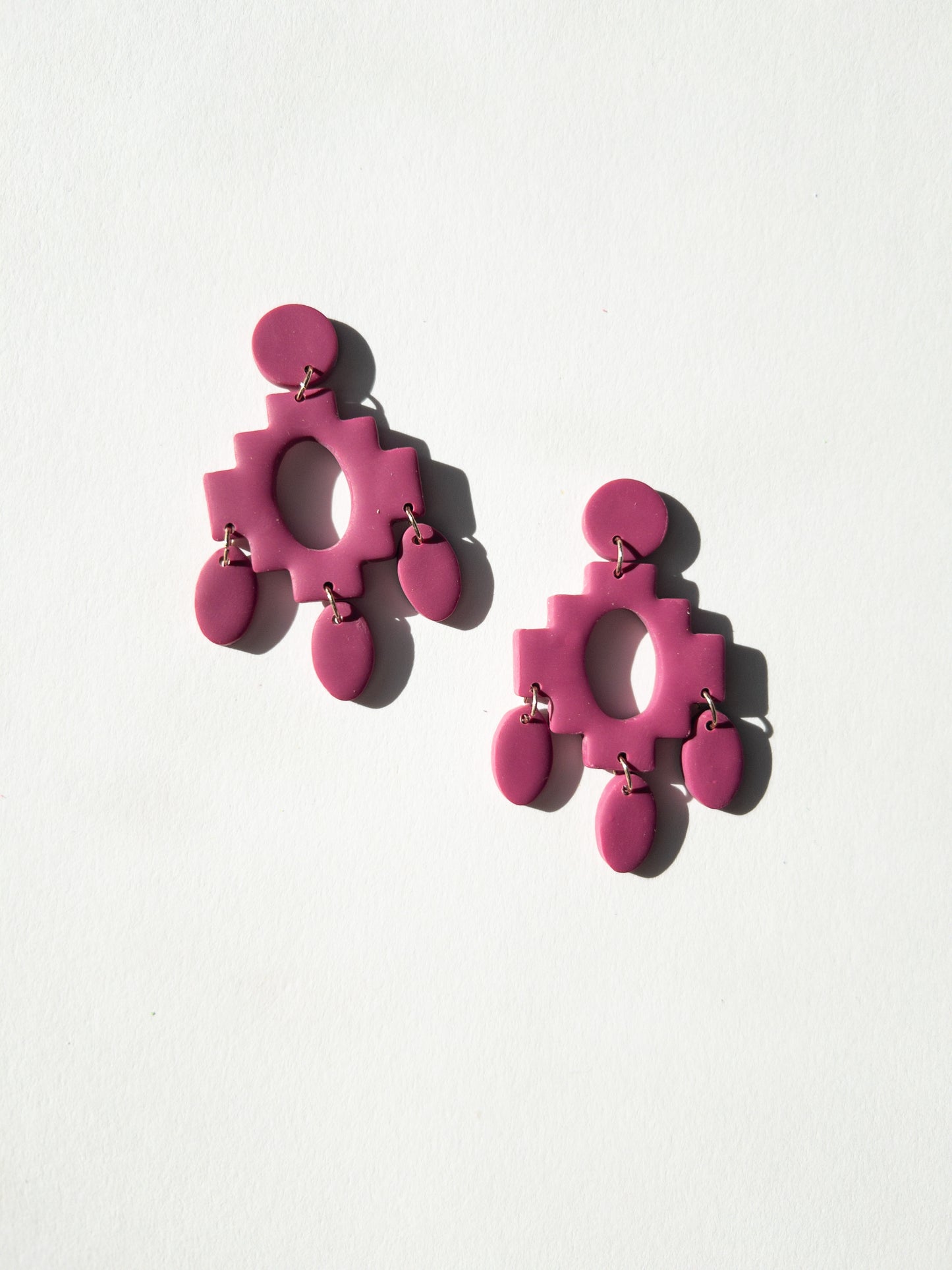 the fuchsia aztec dangle earrings