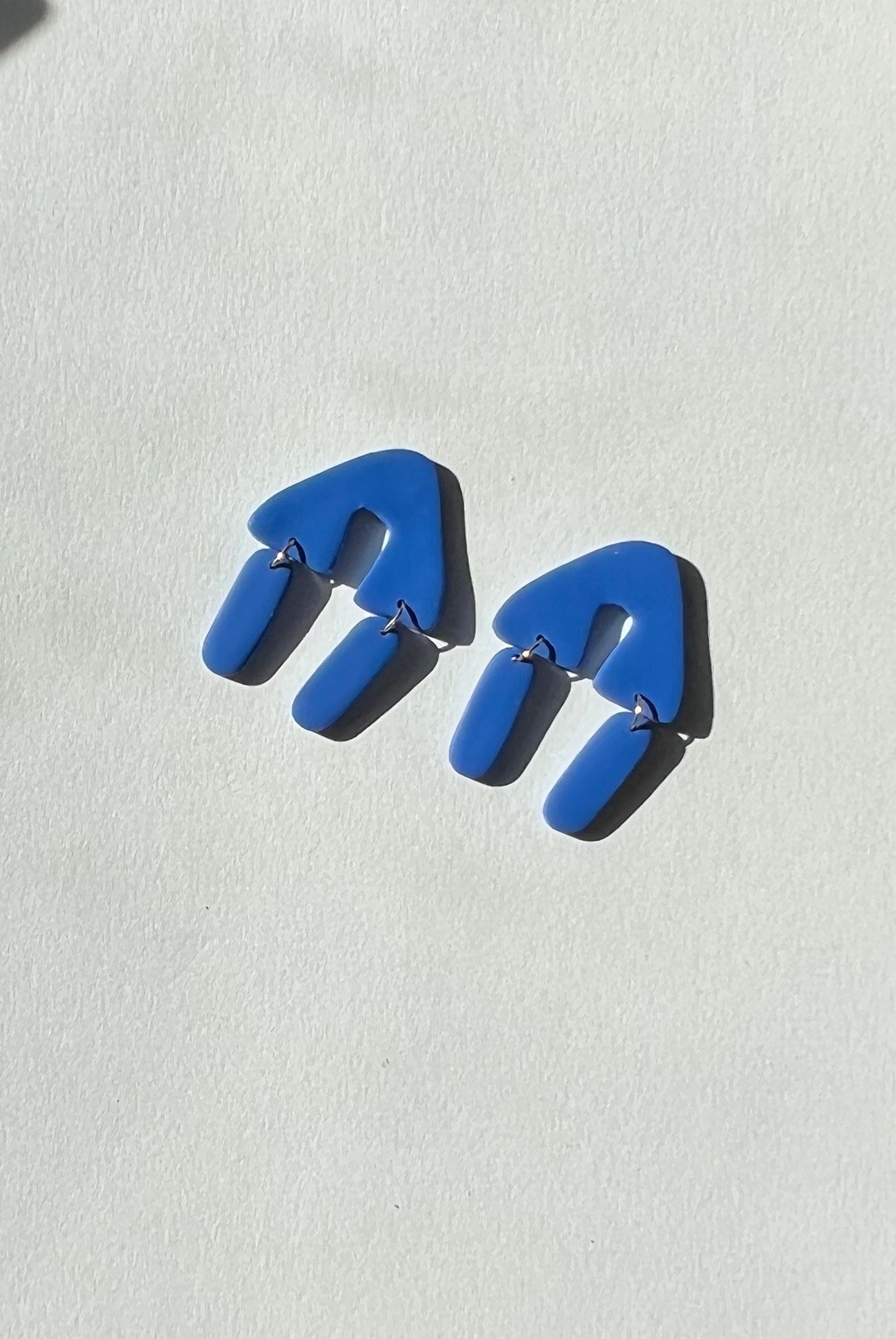 the party in the triangle cobalt earrings
