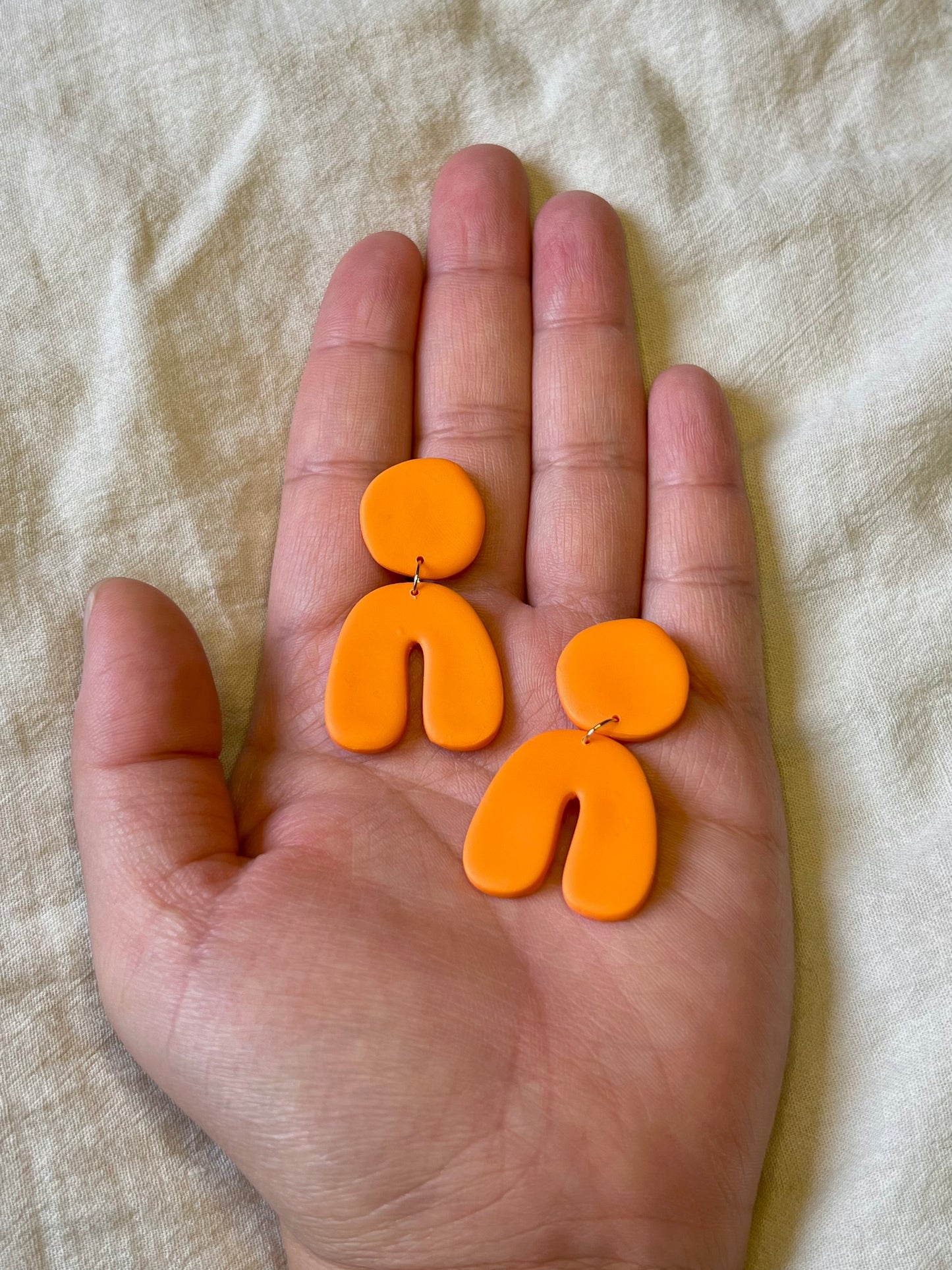 Orange Orange Curvy Arch Dangles