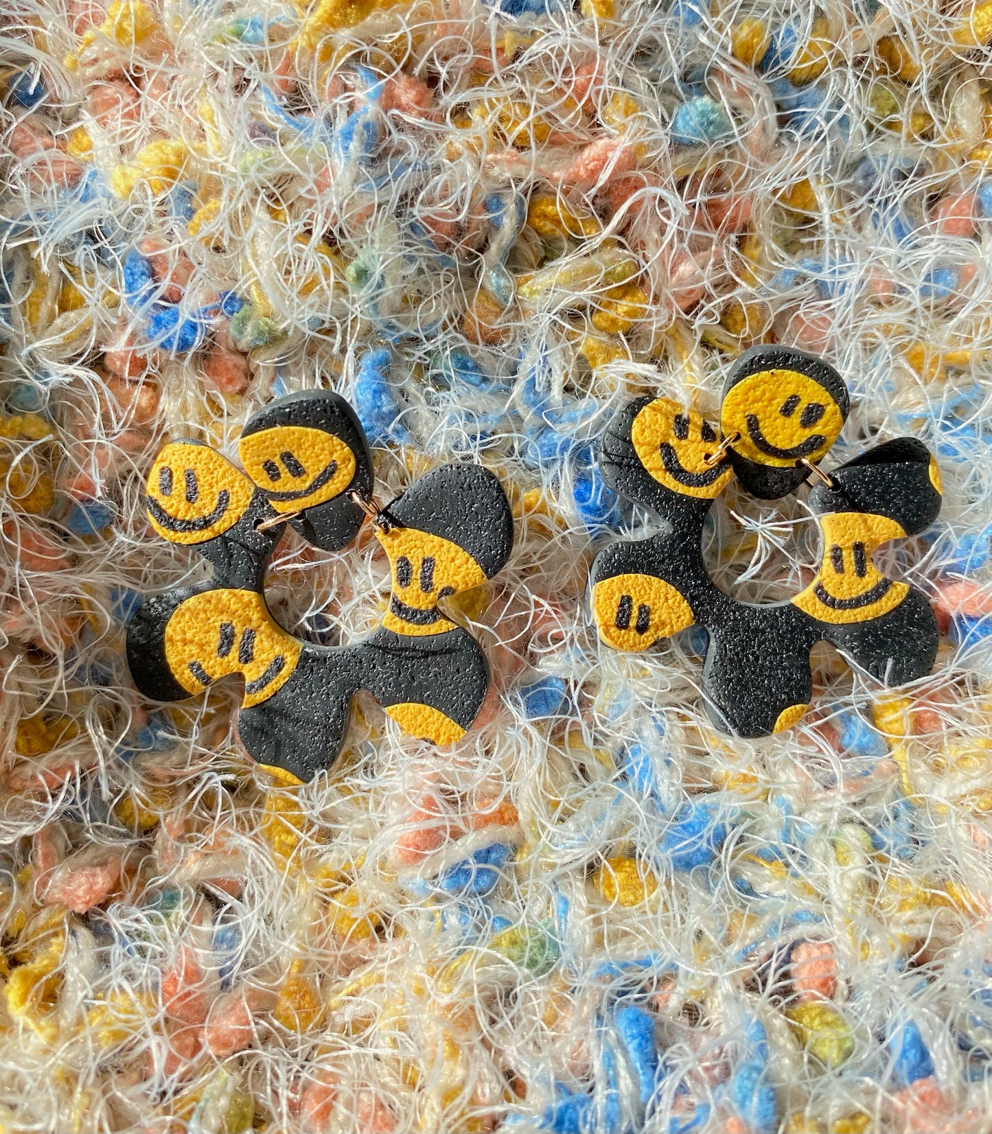 smiley on black flower earrings