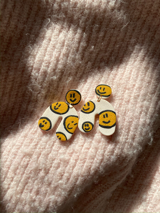 smiley on white chunky arch earrings