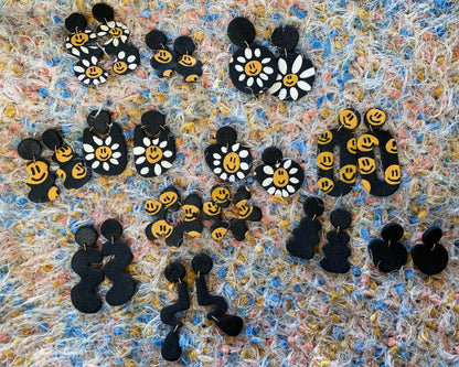 smiley on black oval donut earrings