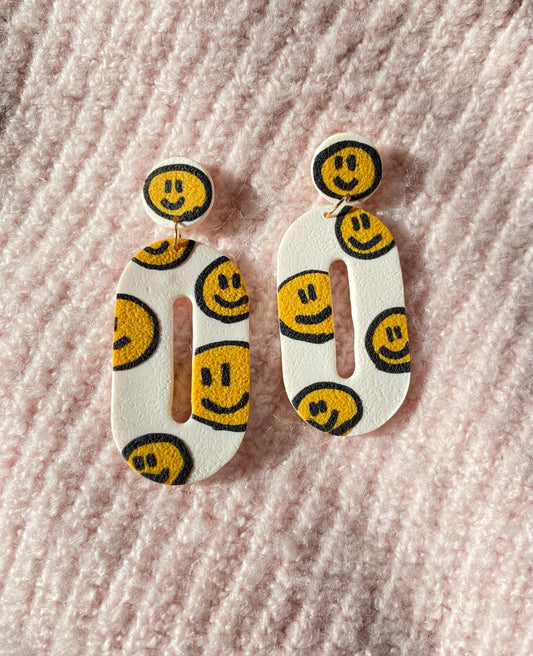 smiley on white round donut earrings