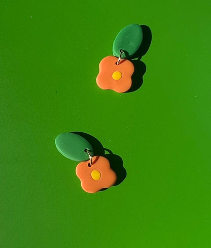 orange 4-petal bb flower - yellow middle earrings