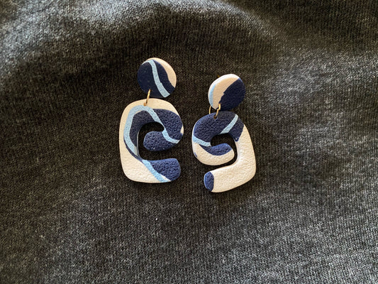 blue and white abstract swirl earrings